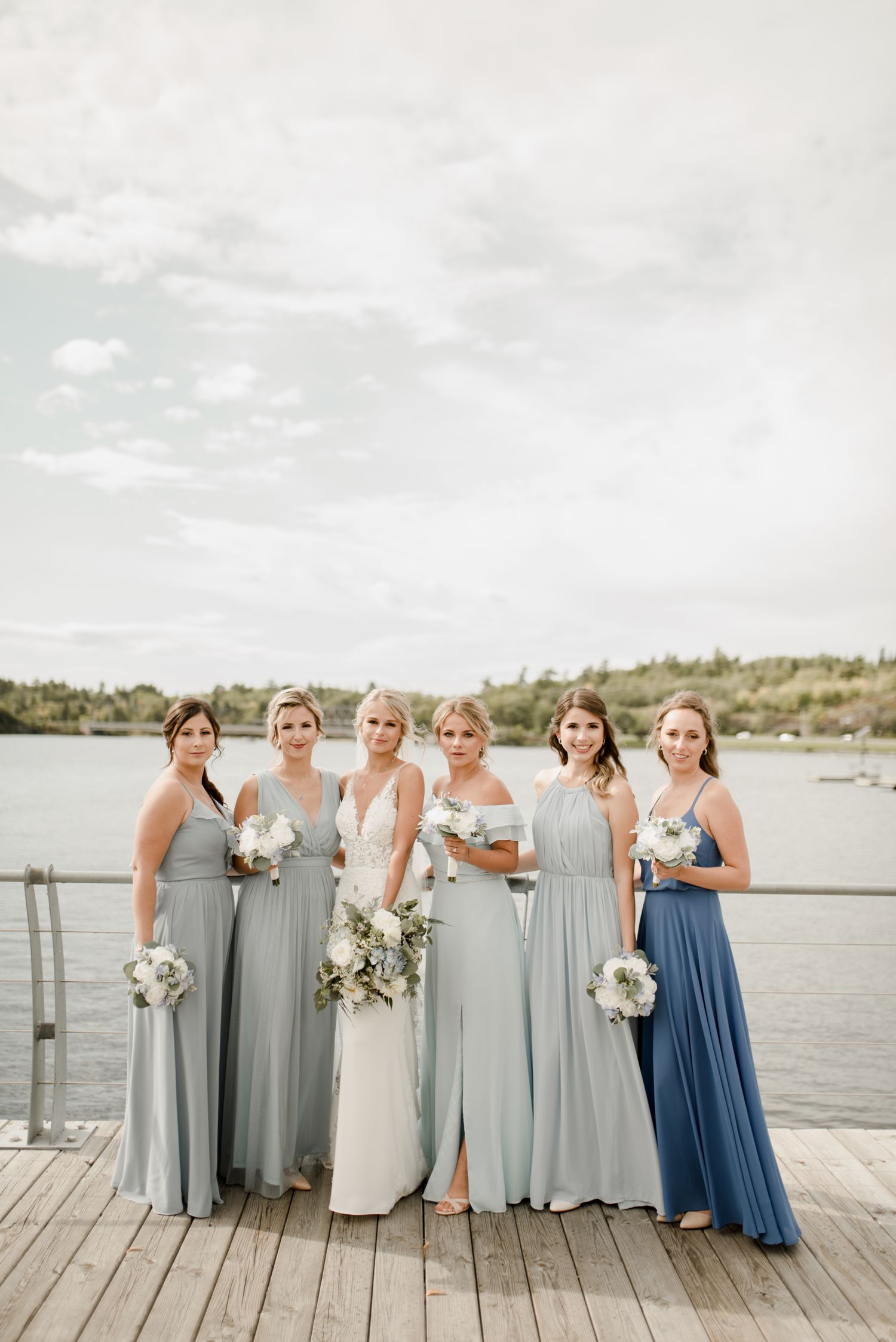 Kenora wedding, a fall wedding in Ontario, photographed by Vanessa Renae Photography, a Winnipeg and Kenora wedding photographer Blue bridesmaid dresses