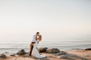 grand beach bridal session on Lake Winnipeg in Manitoba. Elopement style photos by Vanessa Renae Photography, a winnipeg wedding photographer and kenora wedding photographer. Lace wedding dress, beach wedding photos, sunset wedding photos