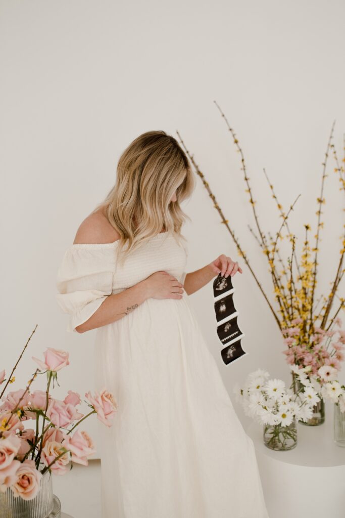 White Studio maternity session with florals by Vanessa Renae Photography, Winnipeg studio maternity session, baby announcement photos