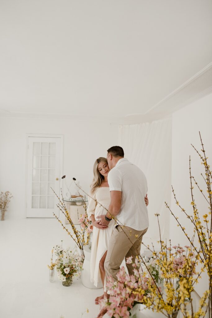 White Studio maternity session with florals by Vanessa Renae Photography, Winnipeg studio maternity session